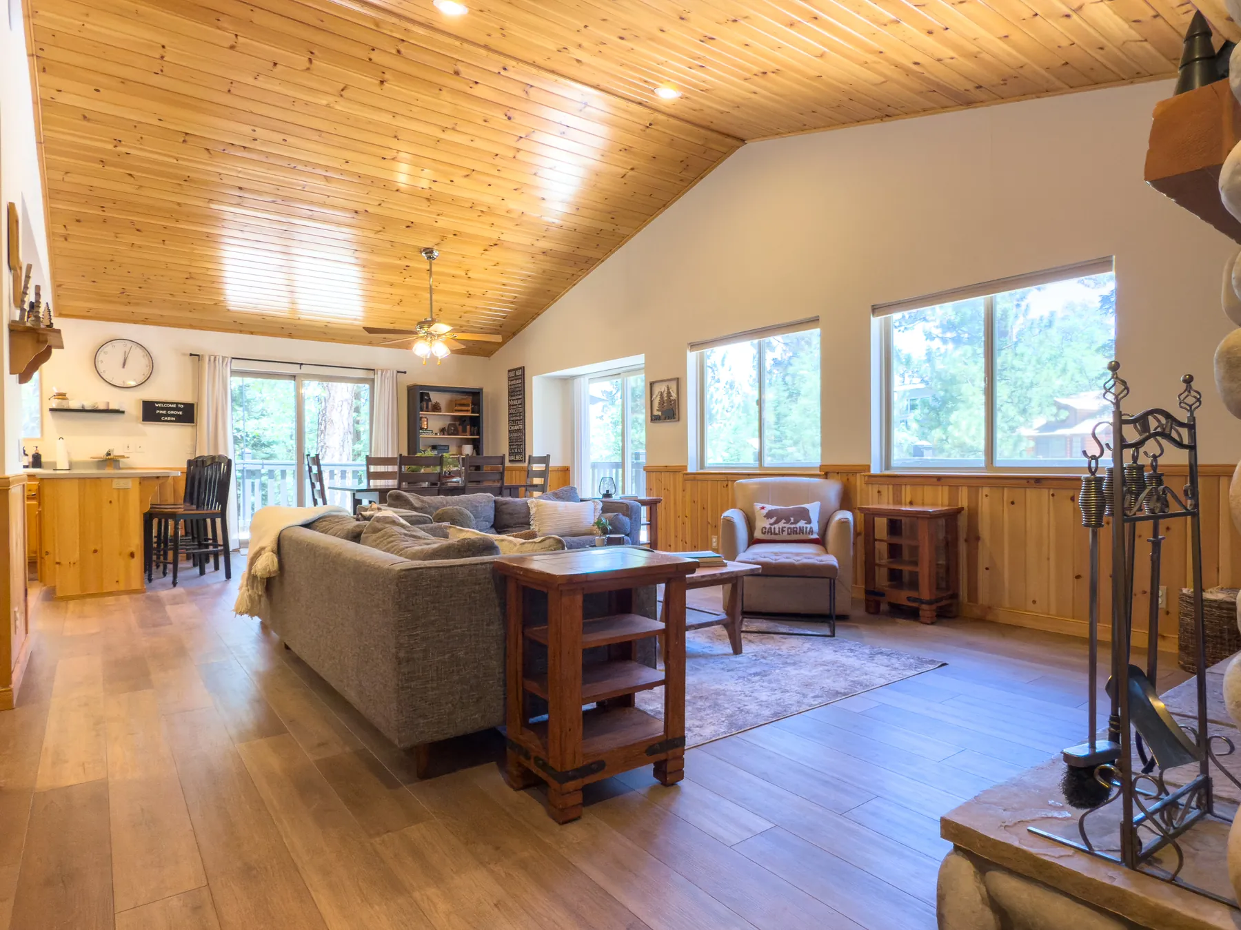 Open-concept living room at Pine Grove Cabin looking toward the kitchen and dining area