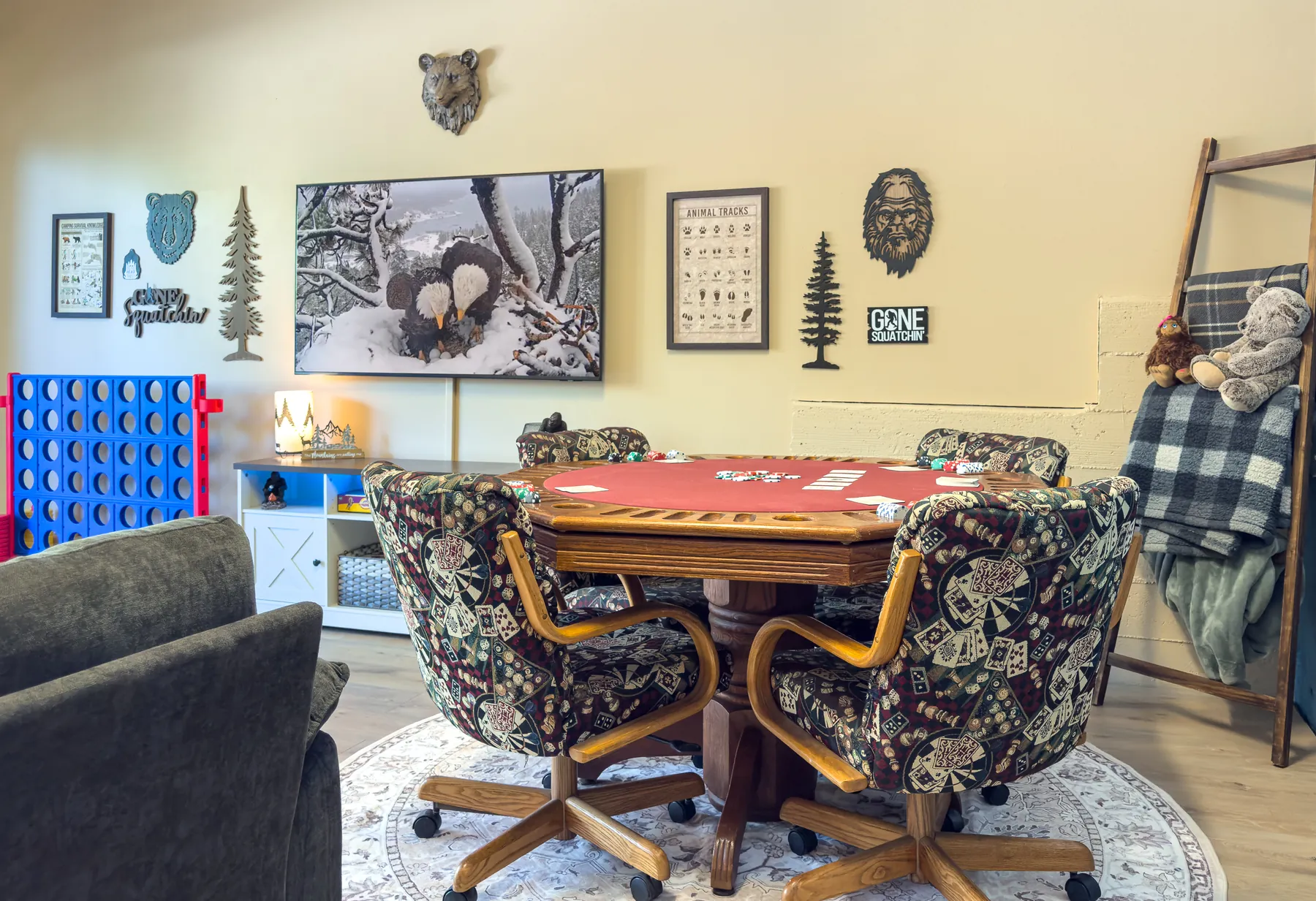 Poker table set up with cards and chips in the Sasquatch Den at Pine Grove Cabin